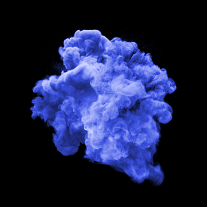 Paint powder or blue dust glitter explosion of stardust smoke isolated on black background. Particular fluid haze effect with magic glowing shimmering texture for fashion glamor cosmetic background design